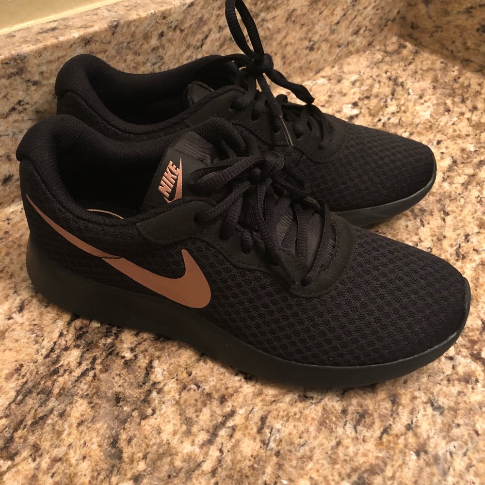 Black Nike shoes with Rose Gold